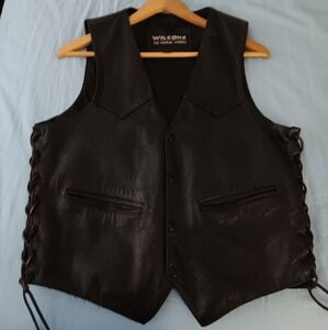 Wilson's black Leather vest,size medium. Back has paint stain on the edge of it.